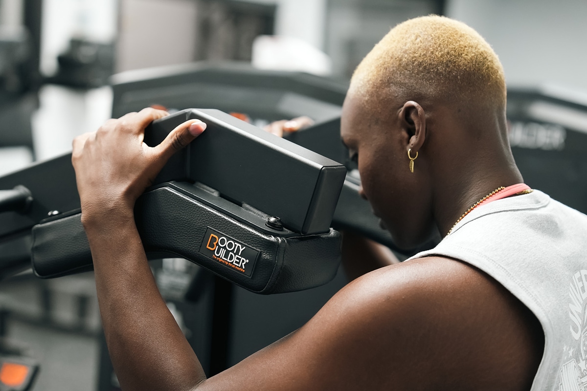 Individual using Body Analyzer device for fitness metrics.