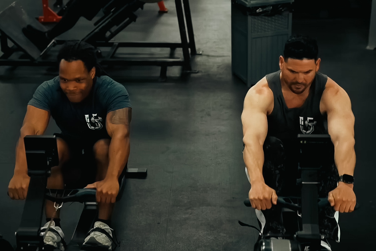 Two individuals using rowing machines for endurance and back strength.